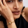 Armband mit facettierter Snake Chain und Herzverschluss, 14-karätig vergoldet Armband mit facettierter Snake Chain und Herzverschluss, 14-karätig vergoldet