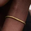 Armband mit rundem Verschluss und Flügelkette, 14-karätig vergoldet Armband mit rundem Verschluss und Flügelkette, 14-karätig vergoldet