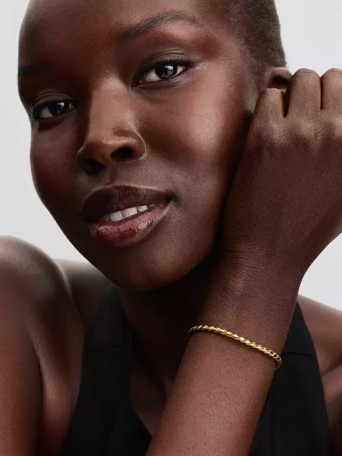 Armband mit rundem Verschluss und Flügelkette, 14-karätig vergoldet Armband mit rundem Verschluss und Flügelkette, 14-karätig vergoldet