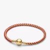 Armband mit Snake Chain und rotem Textilschnurband, 14-karätig vergoldet Armband mit Snake Chain und rotem Textilschnurband, 14-karätig vergoldet