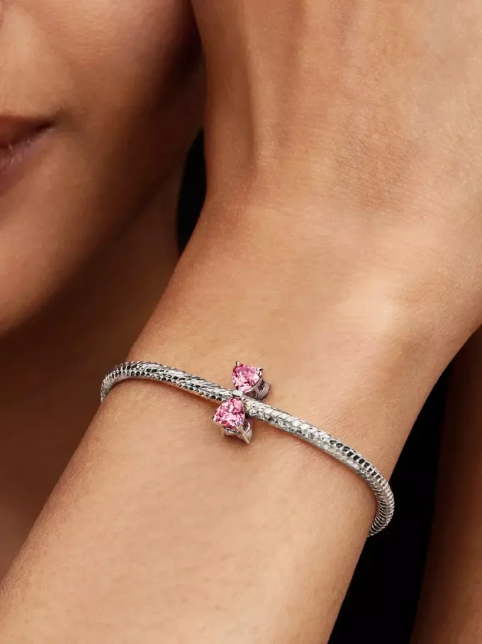 Charm „Rosa Schleife“ aus Sterlingsilber Charm „Rosa Schleife“ aus Sterlingsilber