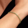 Funkelndes grünes Tennisarmband, 14-karätig vergoldet Funkelndes grünes Tennisarmband, 14-karätig vergoldet