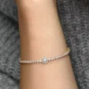 Funkelndes Halo-Tennisarmband, 14-karätig vergoldet Funkelndes Halo-Tennisarmband, 14-karätig vergoldet