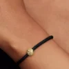 Mini-Charm „Texturierter Globus“ mit 14-karätiger Vergoldung
