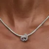 Pavé-Charm „Infinity Knot Heart“ aus Sterlingsilber Pavé-Charm „Infinity Knot Heart“ aus Sterlingsilber