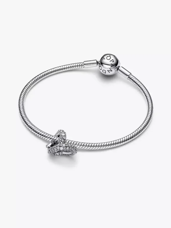 Pavé-Charm „Infinity Knot Heart“ aus Sterlingsilber Pavé-Charm „Infinity Knot Heart“ aus Sterlingsilber