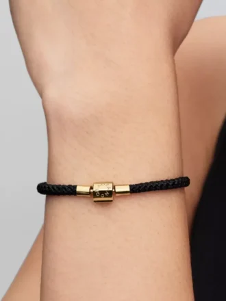 Schimmerndes Armband mit schwarzer Kordel, 14-karätig vergoldet